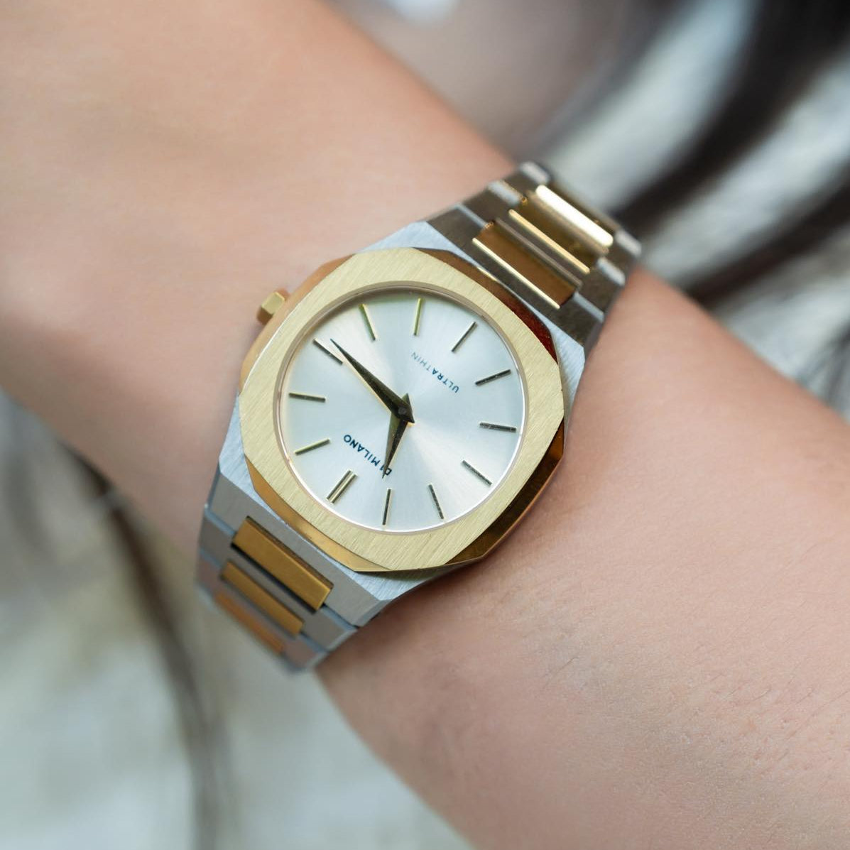 D1 Milano Ultra Thin Edge watch on wrist showing silver sunray dial and rose gold accents