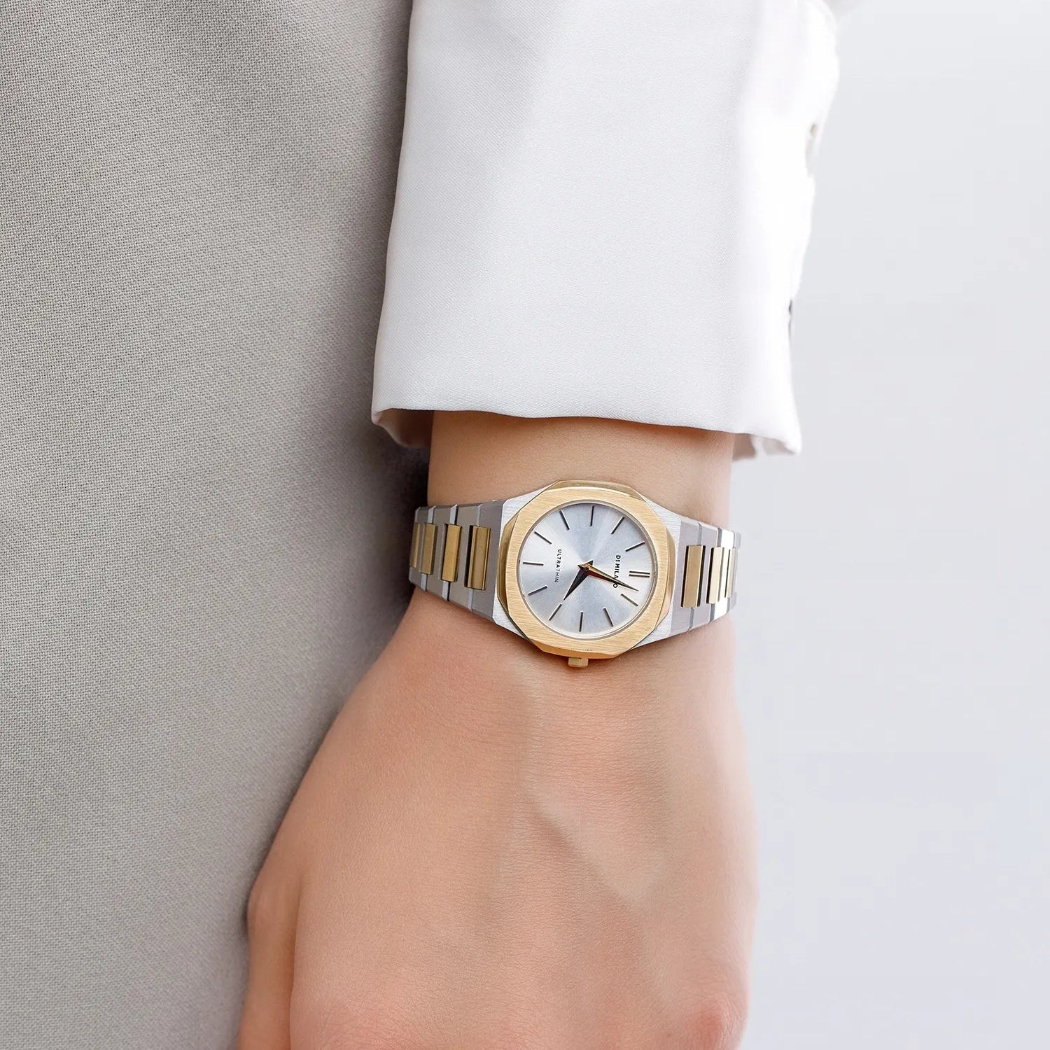 D1 Milano Ultra Thin Edge 30mm watch worn on wrist with silver dial and two-tone bracelet