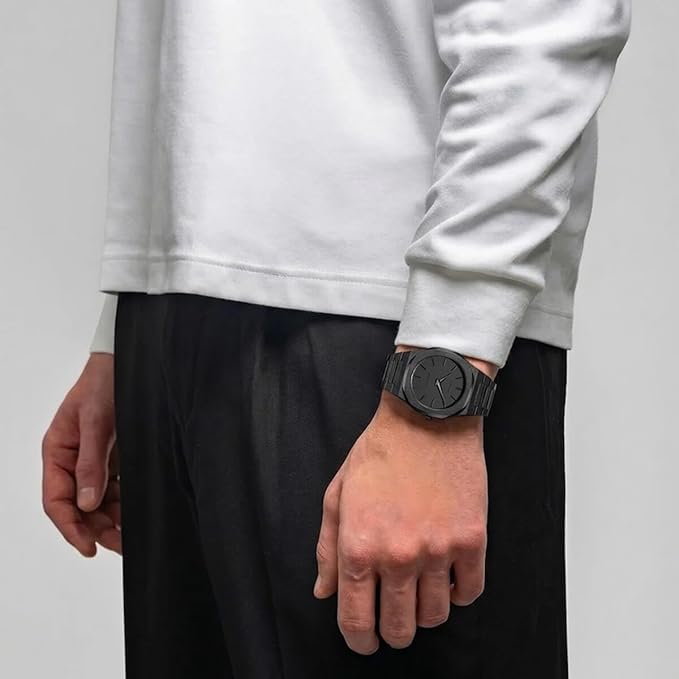 D1 Milano UTBJSH black watch worn on wrist with casual styling