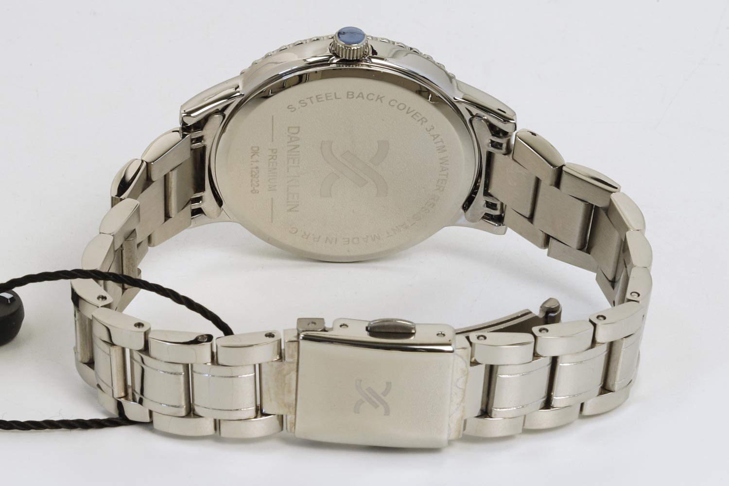 Back of Daniel Klein watch case showing stainless steel caseback and spring bars