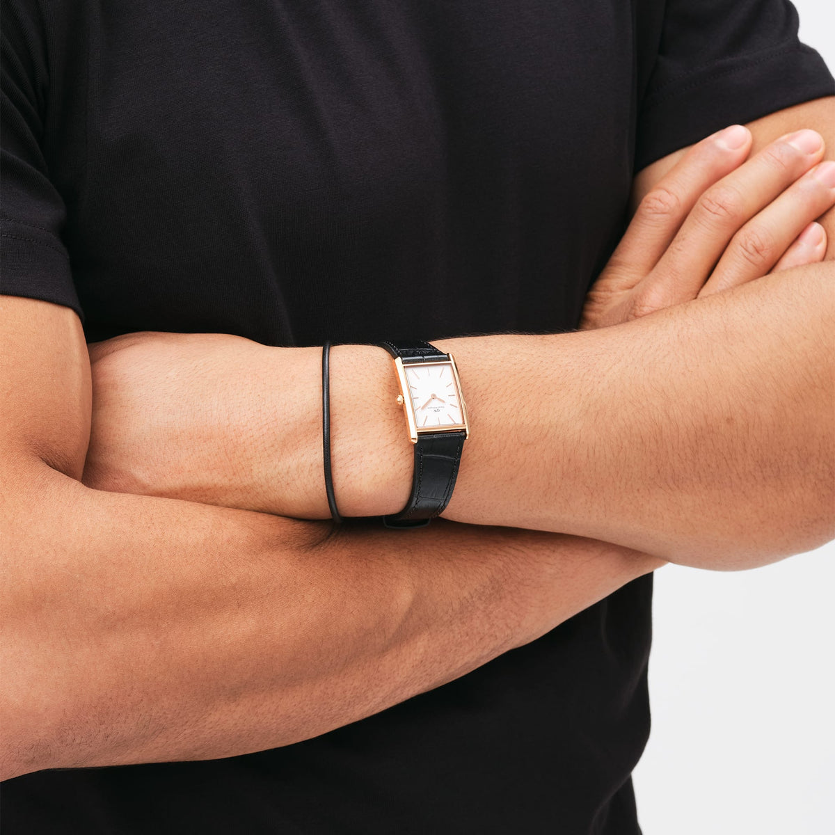 Daniel Wellington Bound watch worn on wrist with black crocodile leather strap