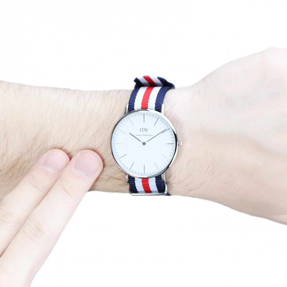 Daniel Wellington Canterbury 40mm silver watch worn on wrist with tricolour NATO strap