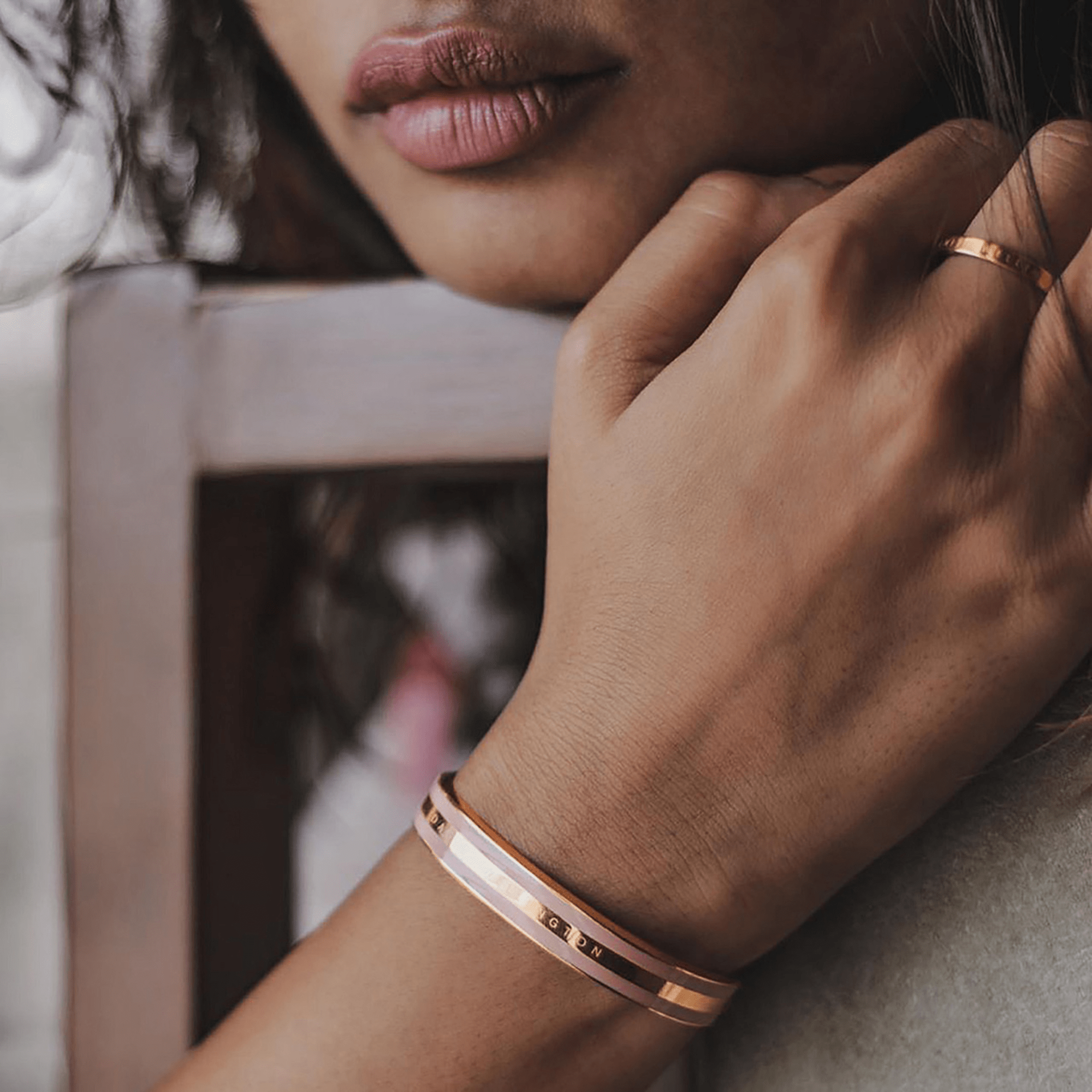 Daniel Wellington dusty rose gold bracelet worn on wrist