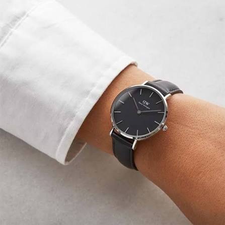 Daniel Wellington Classic watch worn on wrist with white sleeve