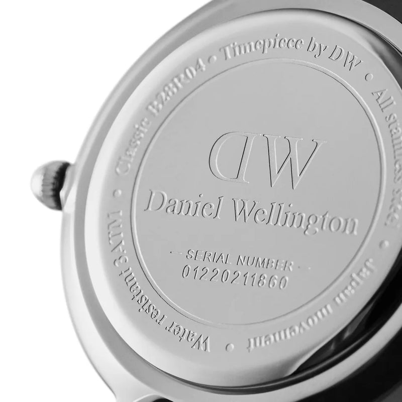 Engraved caseback detail showing Daniel Wellington logo and serial number 01220211660