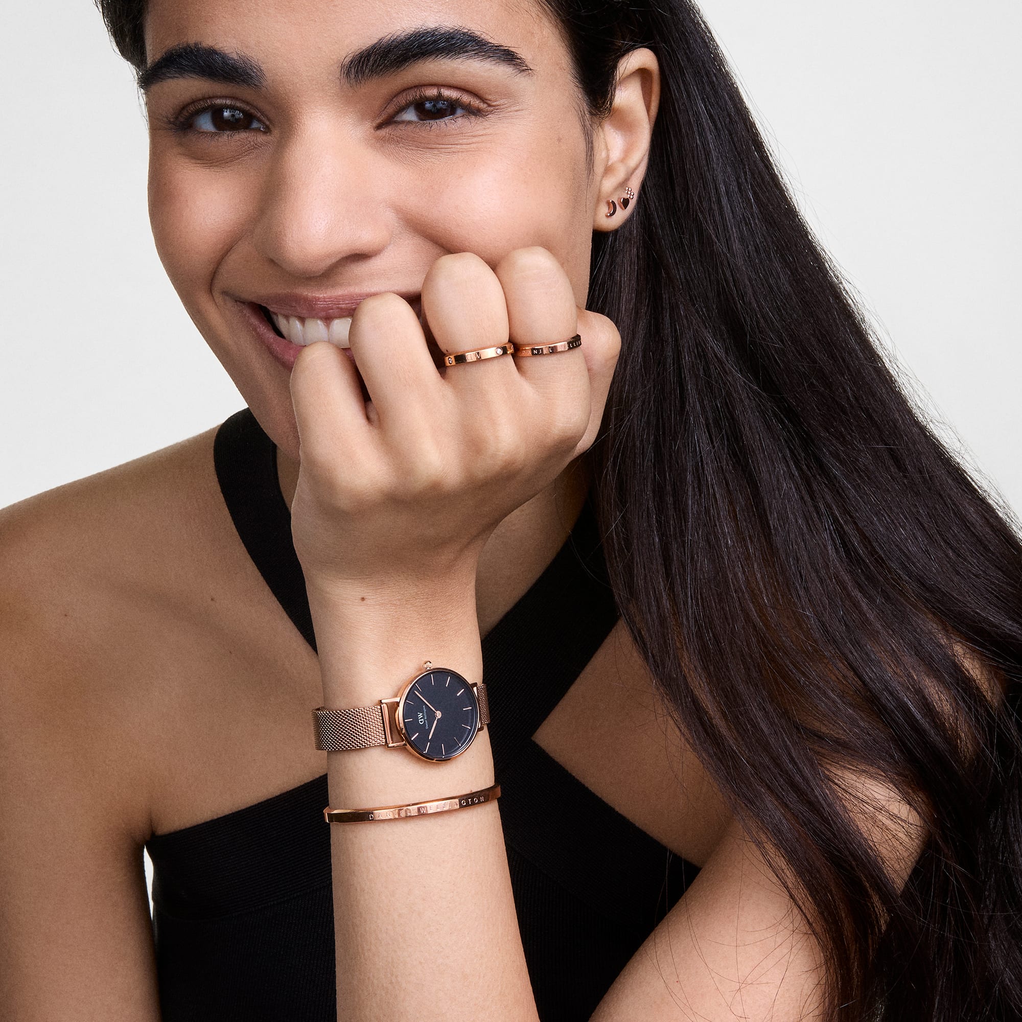 Daniel Wellington Classic rose gold cuff worn on wrist with matching rose gold watch