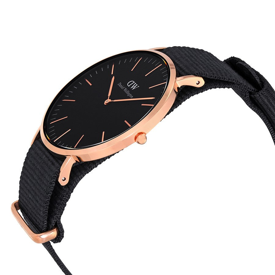 Side angle view of Daniel Wellington Cornwall watch showing rose gold case and black strap