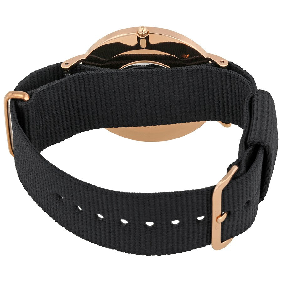 Black fabric strap of Daniel Wellington Cornwall watch with rose gold hardware and adjustment holes