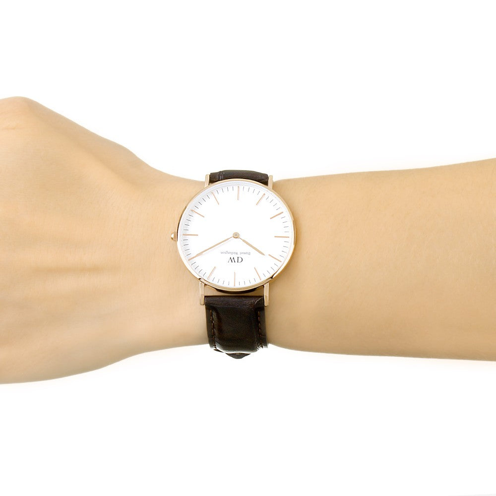 Daniel Wellington Classic York 36mm white dial watch worn on wrist with dark brown leather strap