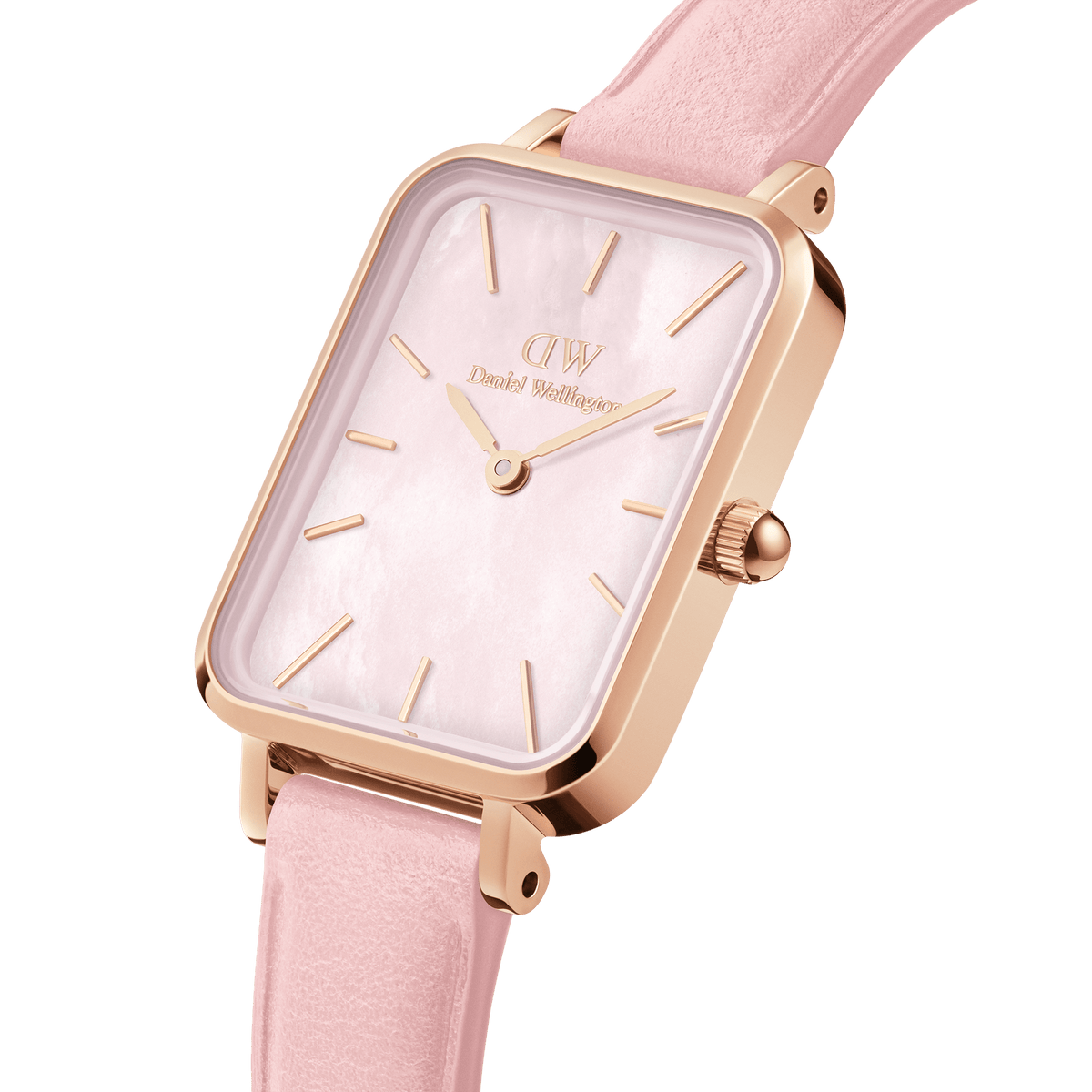 Daniel Wellington watch on wrist showing rose gold case, white dial and pink leather strap