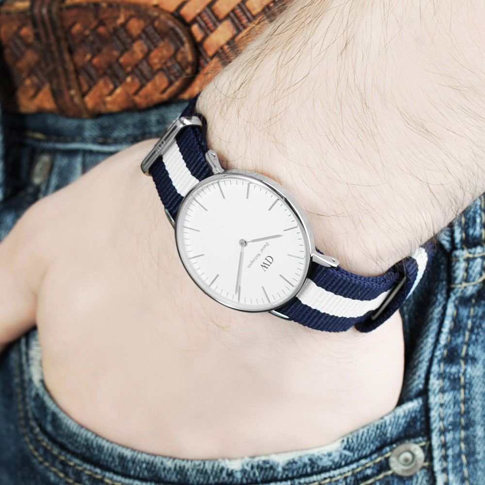 Daniel Wellington Glasgow 40mm watch worn on wrist with navy and white striped strap