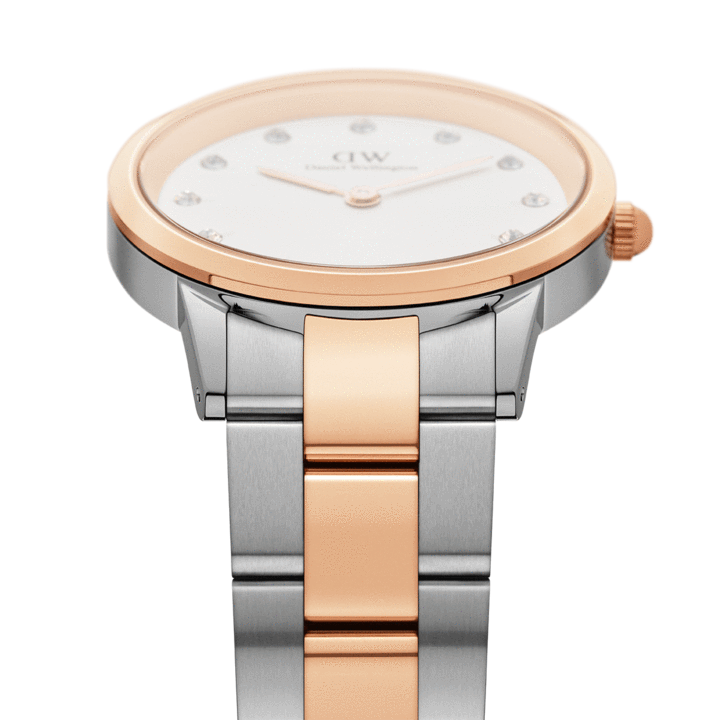 Close-up of white dial with diamond indices, rose gold hands, and DW branding