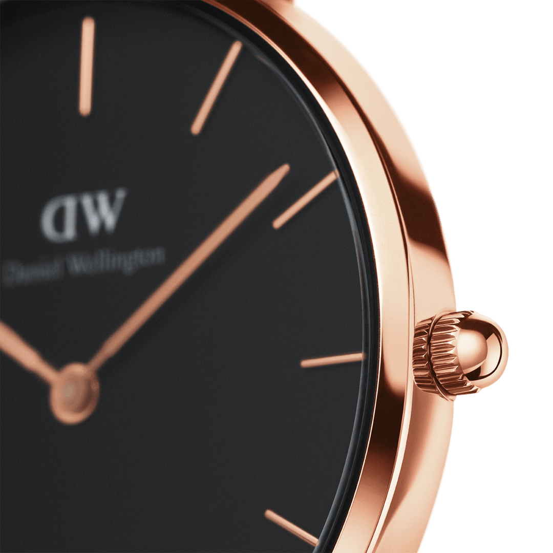 Side angle view of rose gold case with black dial and rose gold hour markers
