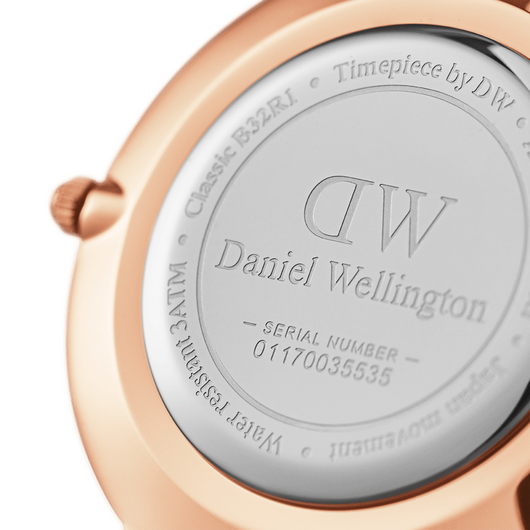 Case back showing DW Daniel Wellington logo and serial number engraved on rose gold