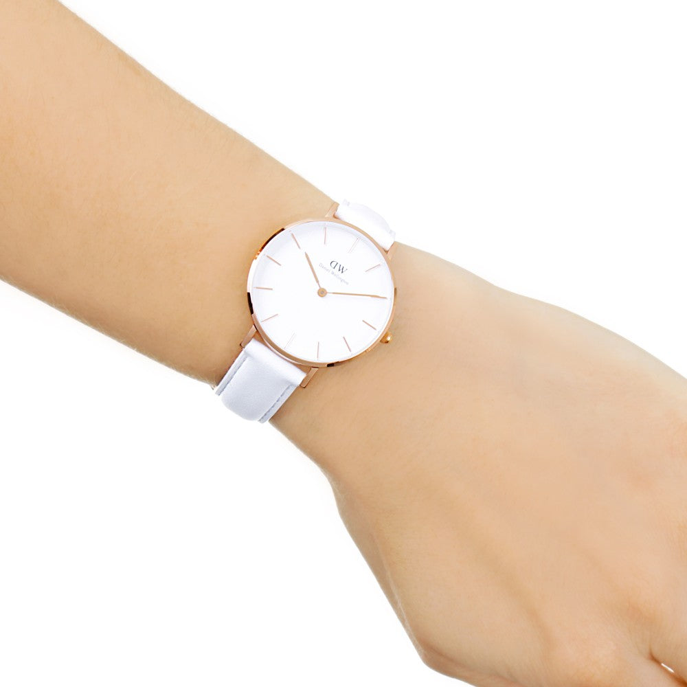 Daniel Wellington Petite Bondi 32mm gold watch worn on wrist with white leather strap