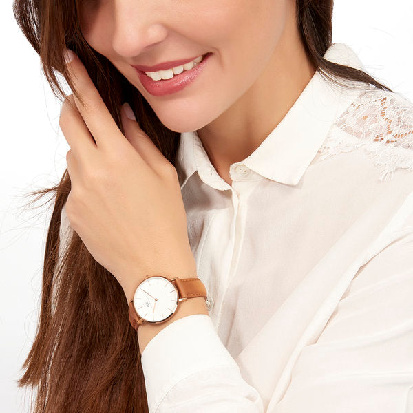 Daniel Wellington Petite Durham 32mm watch worn on wrist, white dial with brown leather strap