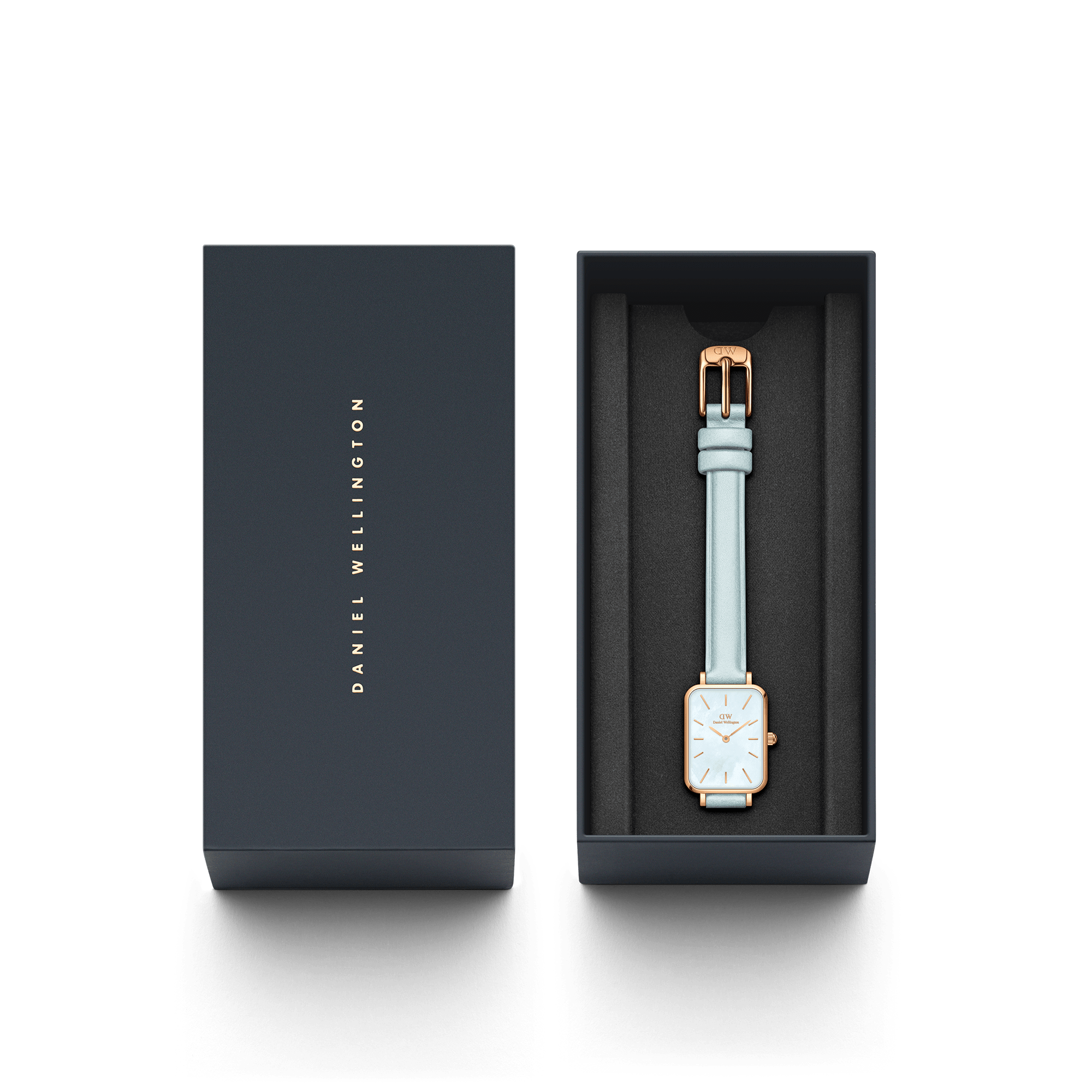 Daniel Wellington Quadro watch displayed in branded dark presentation box with light blue strap