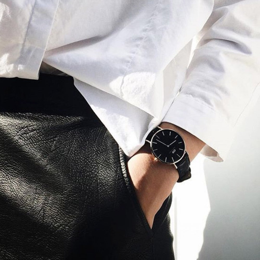 Daniel Wellington Reading watch worn on wrist with black dial and leather strap