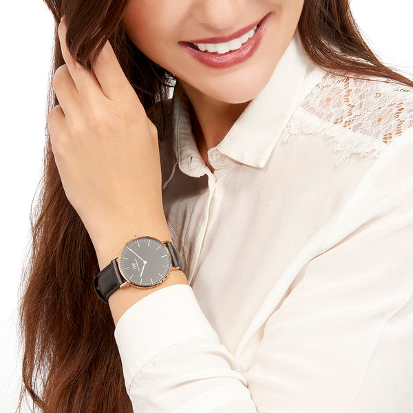 Daniel Wellington Sheffield watch on wrist with rose gold case and black leather strap