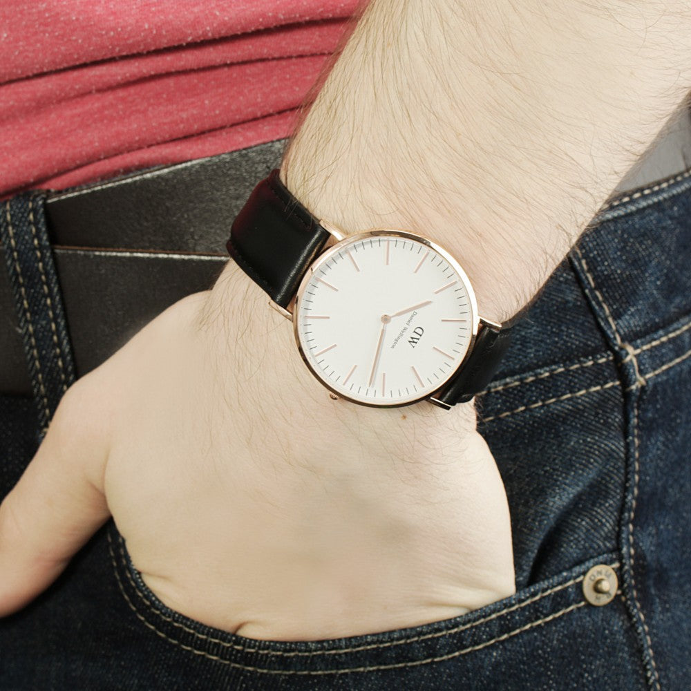 Daniel Wellington Sheffield watch on wrist showing rose gold case and black leather strap