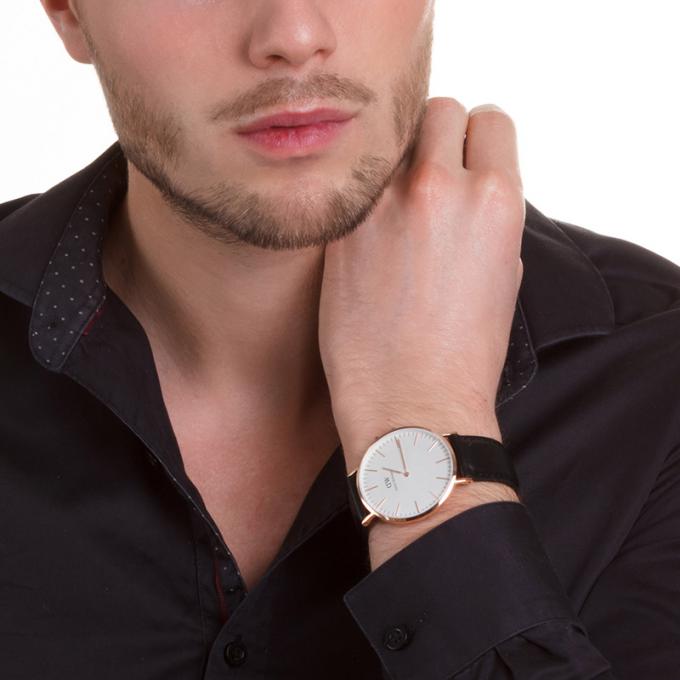 Daniel Wellington Sheffield 40mm watch worn on wrist with white dial and black leather strap
