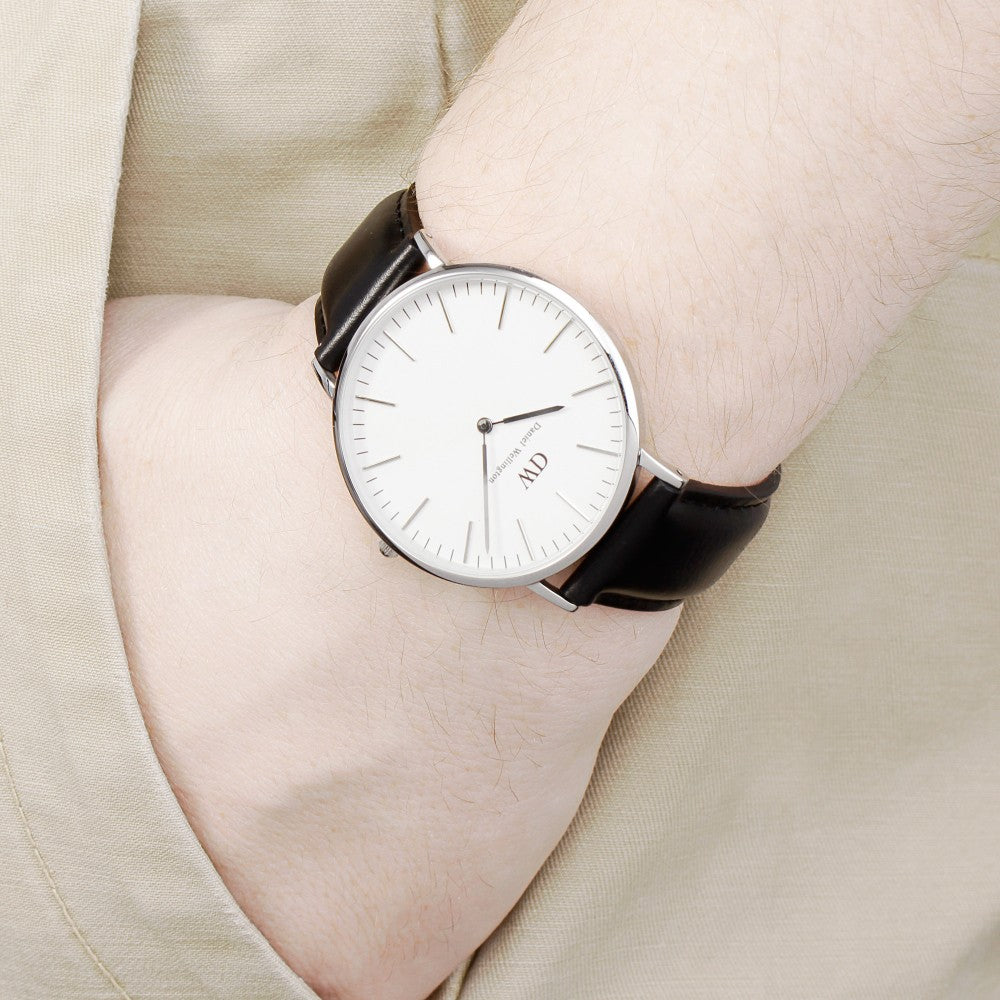 Daniel Wellington Sheffield 40mm watch worn on wrist, white dial and black leather strap visible