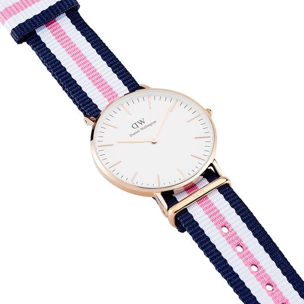 Daniel Wellington Southampton 36mm watch worn on wrist showing white dial, rose gold case, and tricolour fabric strap