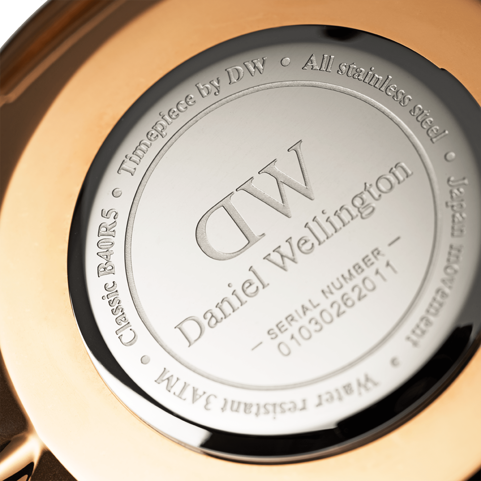 Caseback engraved with DW logo, Daniel Wellington name, serial number, and stainless steel certification