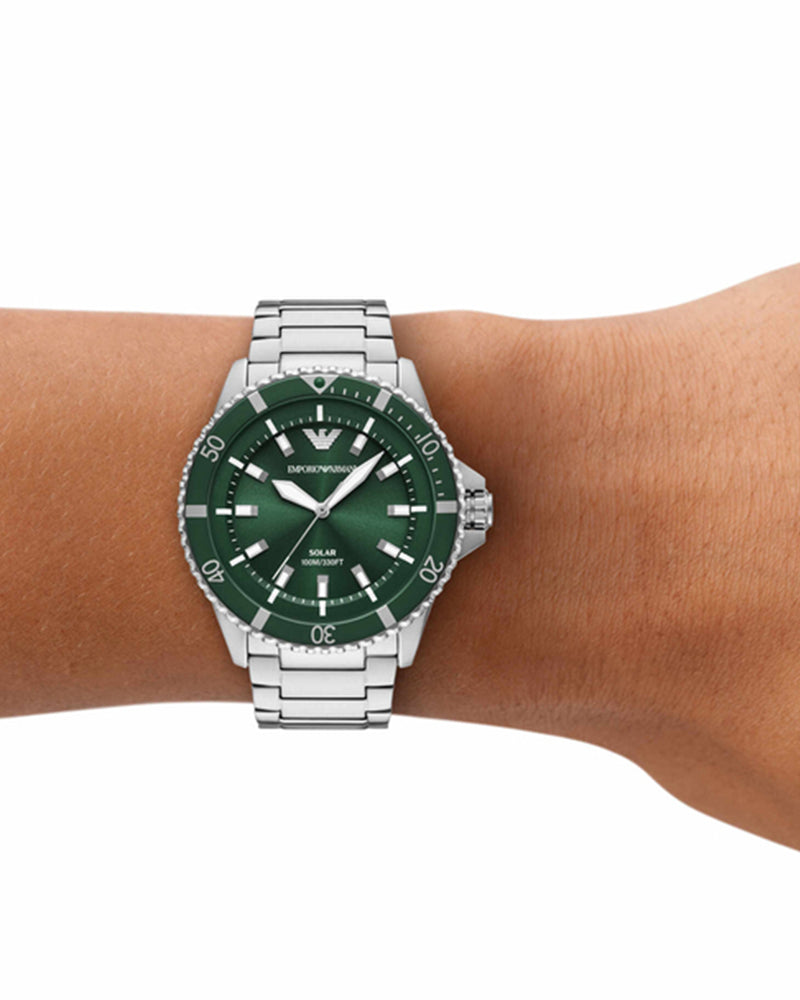 Emporio Armani AR11698 solar watch worn on wrist showing green dial and rotating bezel
