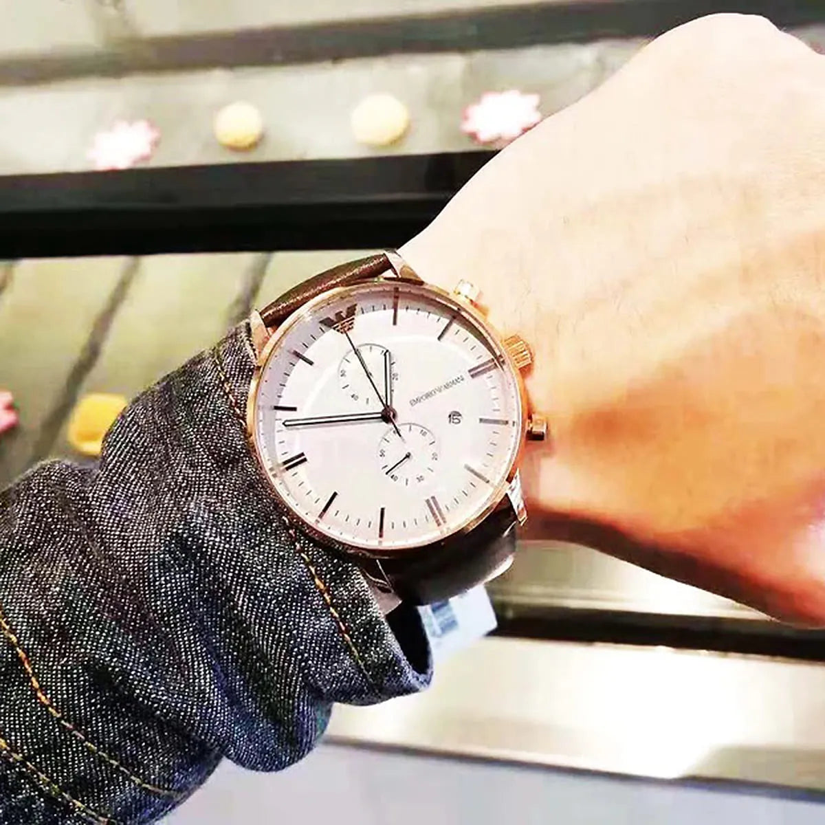 Emporio Armani AR1936 chronograph watch on wrist showing rose gold case and white dial