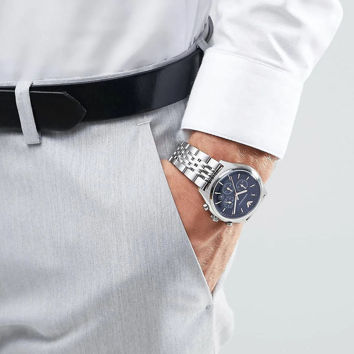 Emporio Armani AR1974 chronograph watch worn on wrist with white dress shirt and gray pants