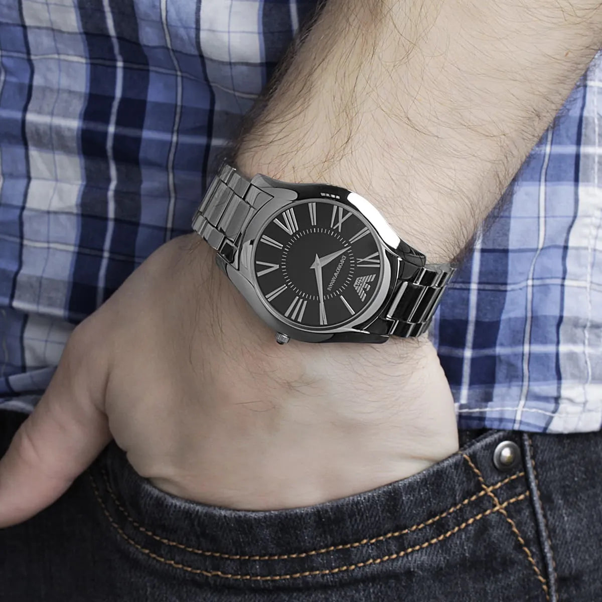 Emporio Armani AR2022 watch on wrist displaying dial and bracelet against checkered shirt