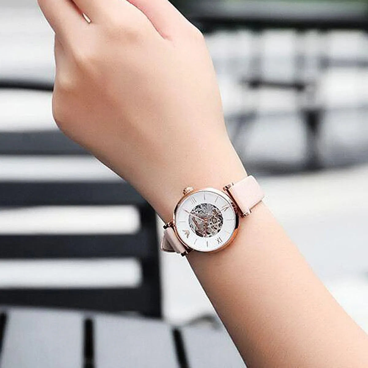 Emporio Armani AR60001 Meccanico skeleton watch on wrist with beige leather strap