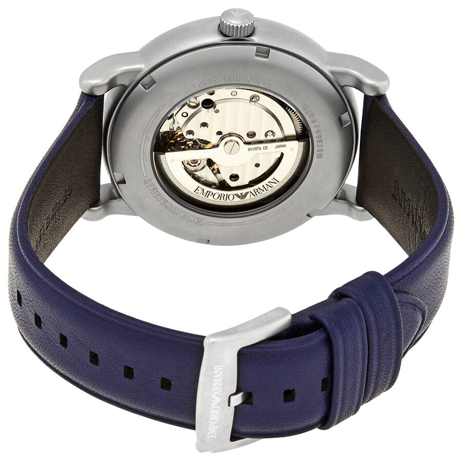 Emporio Armani AR60011 caseback showing automatic skeleton movement with visible gears and jewels through transparent back