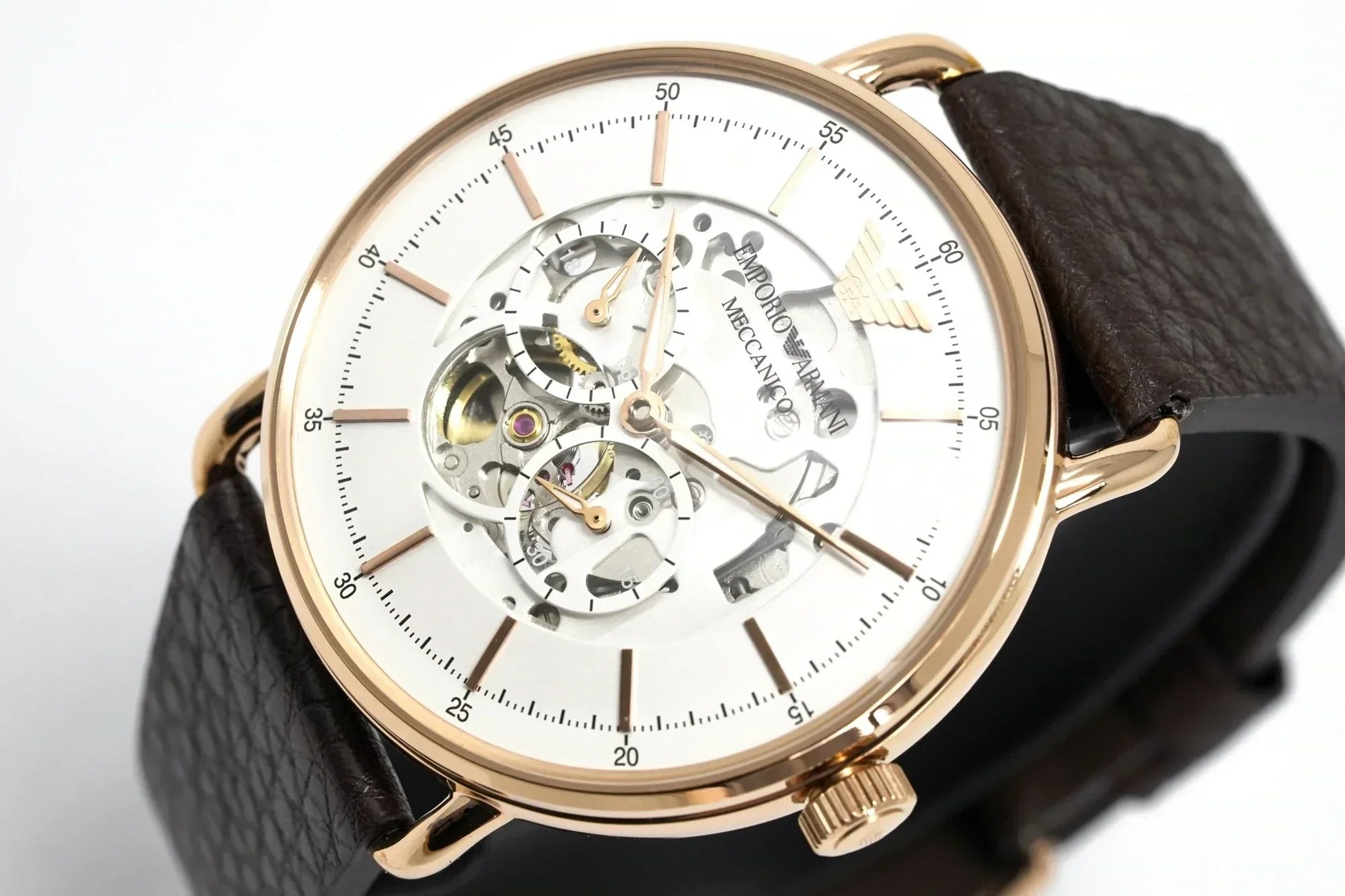 Angled front view of automatic skeleton watch with visible movement