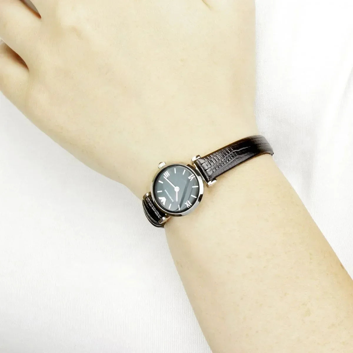 Emporio Armani Gianni T-Bar Mini watch on wrist displaying full band and silver case