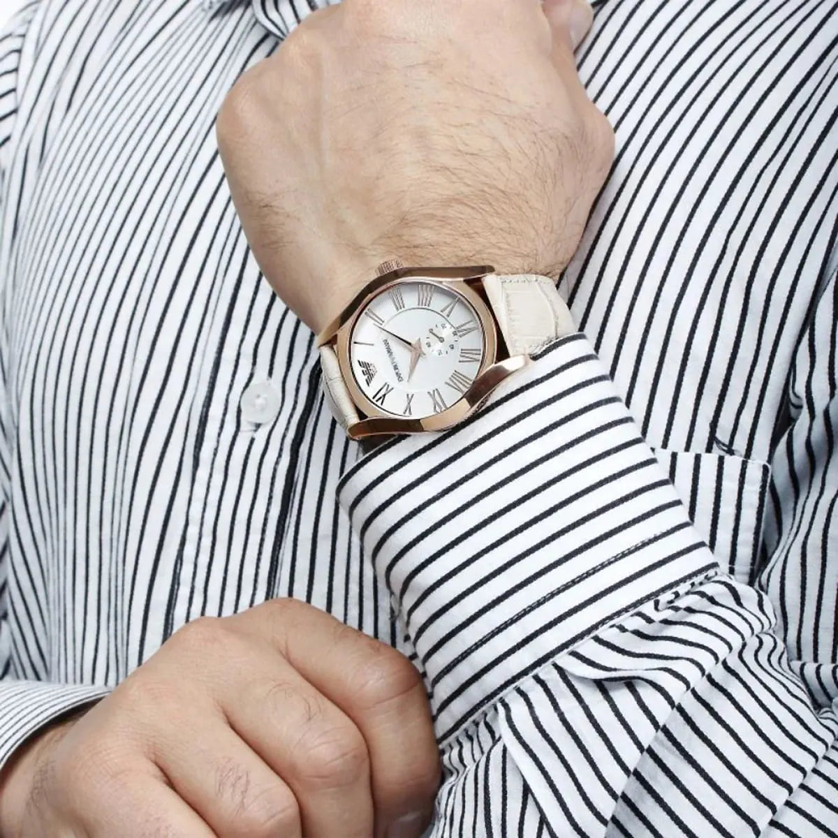Emporio Armani Valente AR1667 worn on wrist with beige dial and rose gold case