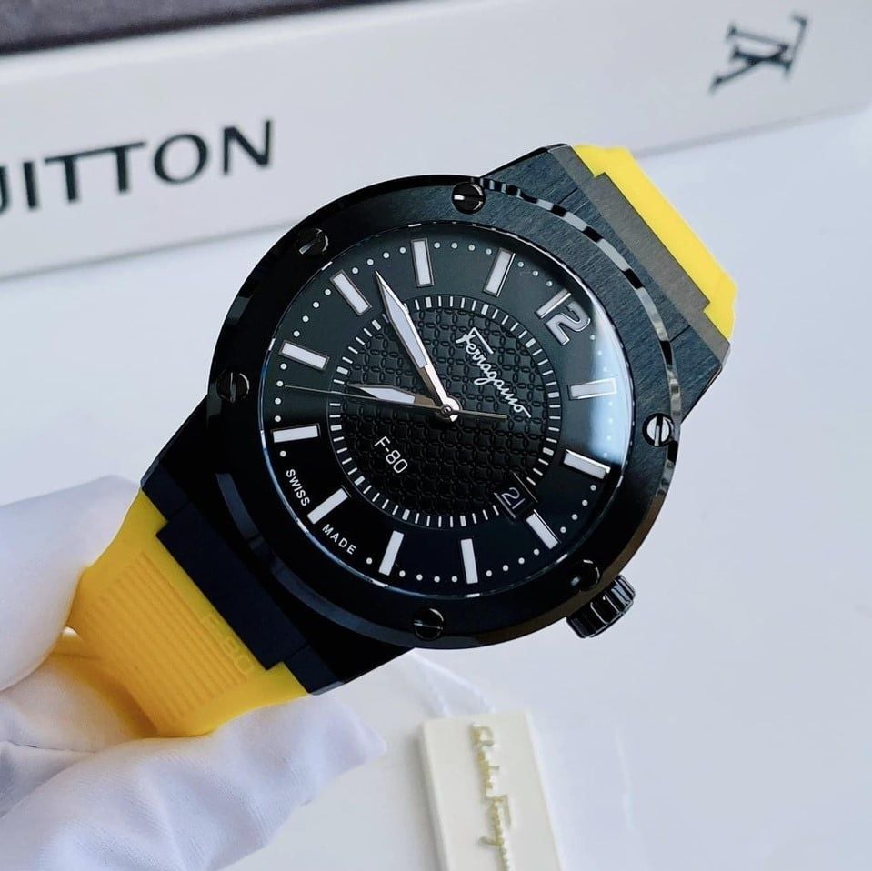 Ferragamo F-80 watch on wrist with yellow strap in lifestyle setting