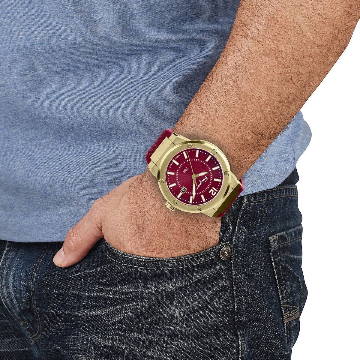 Ferragamo F-80 men's watch worn on wrist with red dial and gold-tone case