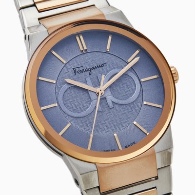 Three-quarter angle view of Ferragamo Salvatore watch showing blue textured dial and two-tone bracelet