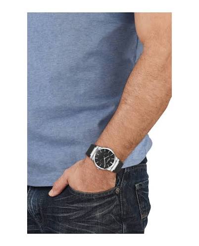 Ferragamo Sapphire 41mm black watch worn on male wrist over blue shirt