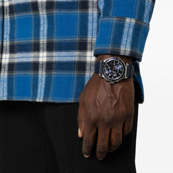 Ferragamo chronograph watch worn on wrist with blue dial and navy leather strap