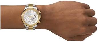 Fossil Bannon chronograph watch worn on wrist, gold-tone and silver two-tone design
