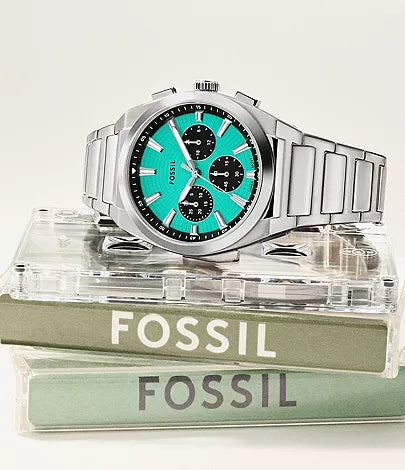Fossil Everett watch displayed on stacked Fossil branded boxes with packaging