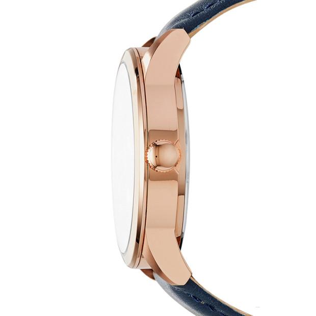 Side profile of Fossil Flynn watch showing rose gold case thickness and navy leather strap
