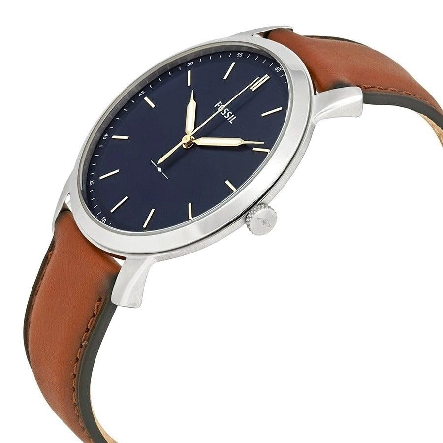 Fossil FS5304 three-hand minimalist watch worn on wrist with light brown leather strap