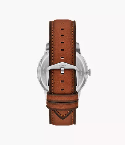 Fossil Inscriptor watch back showing brown leather strap with stitching details
