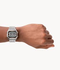 Fossil Retro Digital FS5844 silver-tone watch worn on wrist showing face and metal band