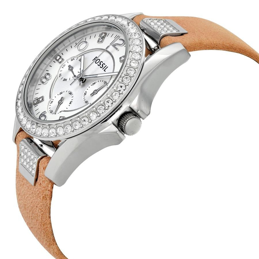 Fossil Riley watch side view showing silver case, crystal bezel and tan leather strap