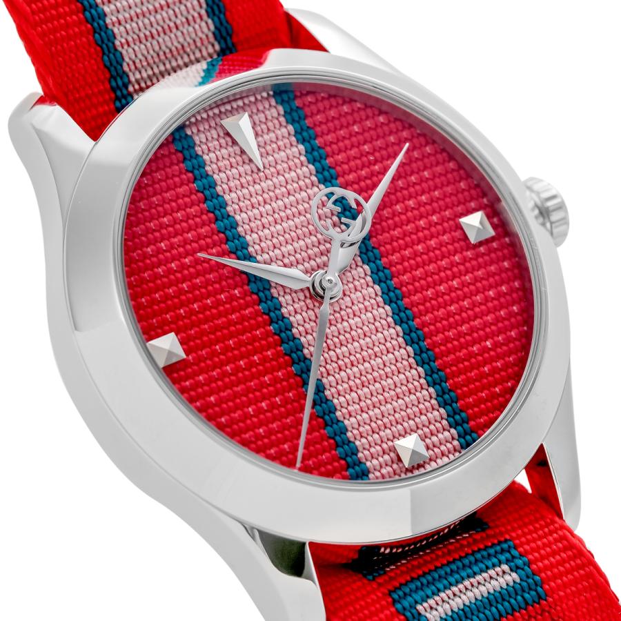 Close-up of G-Timeless 38mm dial with striped pattern and white hands